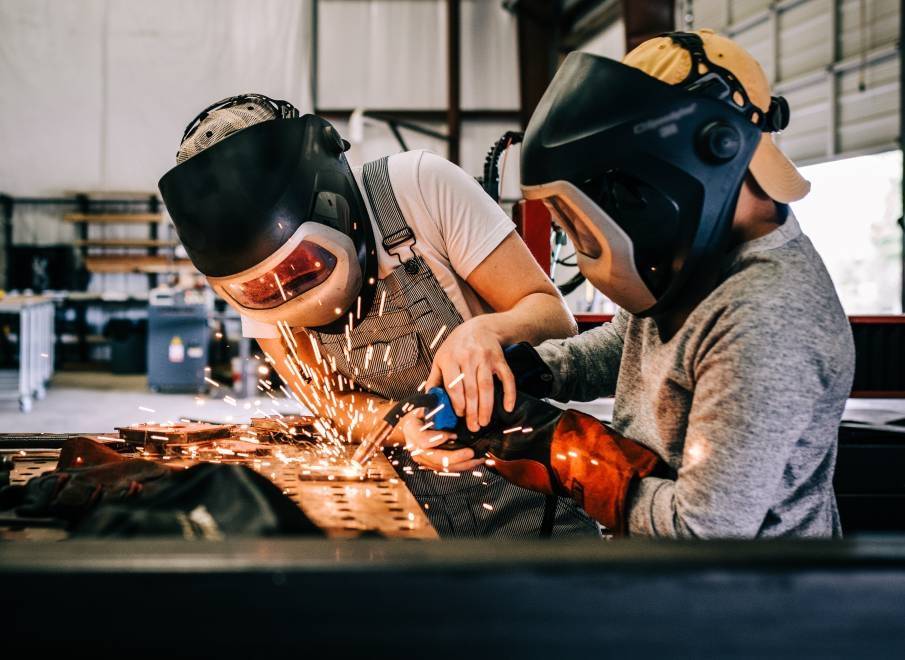 A welder teaches a student about the different types of welding and respective techniques